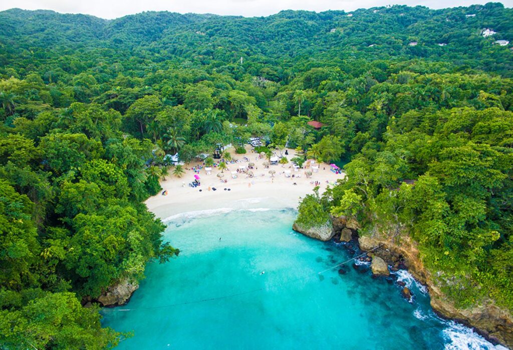 Aerial view of Frenchman’s Cove beach and turquoise waters surrounded by tropical forest in Jamaica